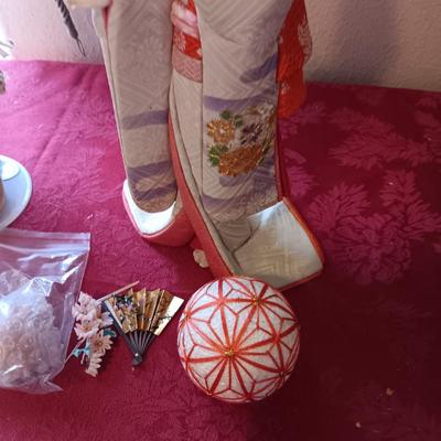 MANY STARS NATIVE AMERICAN THEMED DOLL AND A GEISHA PORCELAIN DOLL
