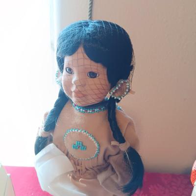 MANY STARS NATIVE AMERICAN THEMED DOLL AND A GEISHA PORCELAIN DOLL