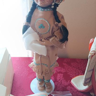 MANY STARS NATIVE AMERICAN THEMED DOLL AND A GEISHA PORCELAIN DOLL