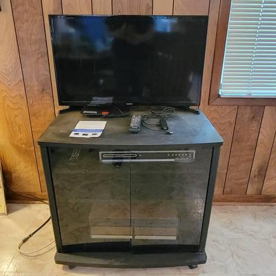 Samsung Flat Screen TV, Amazon Fire Stick, Magnavox DVD Player, TV Stand