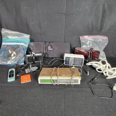 Miscellaneous Electronics: (2) Amazon Firesticks, Clocks, Assorted Cables And Cords