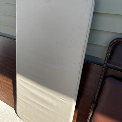 two folding tables and chair