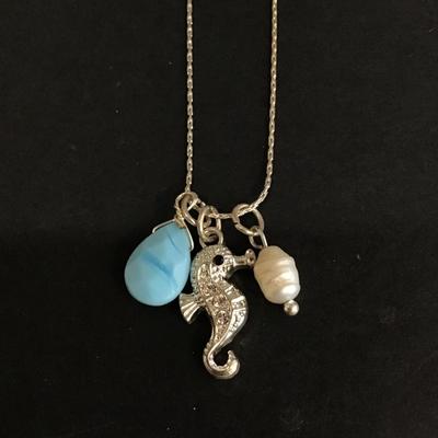 Silver tone necklace with seahorse charm