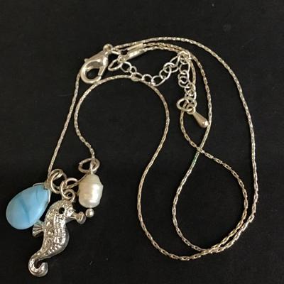 Silver tone necklace with seahorse charm
