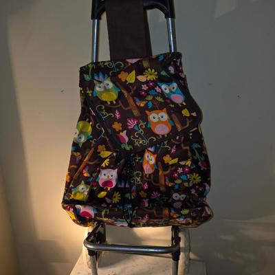 Owl tote on wheels.