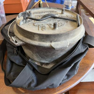 Sale Photo Thumbnail #31: This is for a heavy duty camping Dutch oven from camp chef. Needs cleaning but in very good condition. Has bag that goes with it.