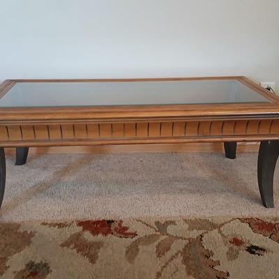 Elegant Glass-Top Coffee Table with Carved Wood Trim