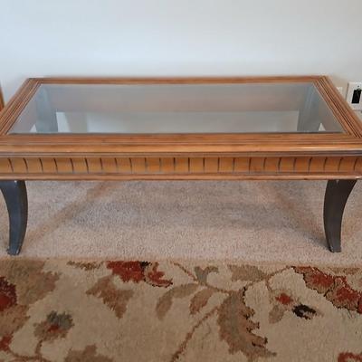 Elegant Glass-Top Coffee Table with Carved Wood Trim