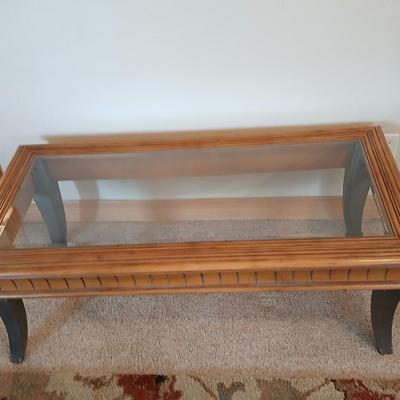 Elegant Glass-Top Coffee Table with Carved Wood Trim