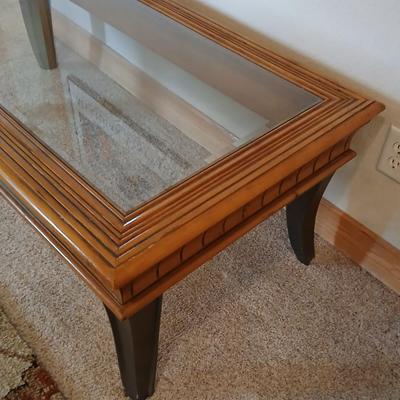 Elegant Glass-Top Coffee Table with Carved Wood Trim