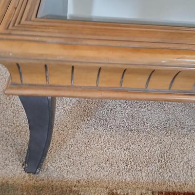 Elegant Glass-Top Coffee Table with Carved Wood Trim