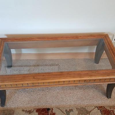 Elegant Glass-Top Coffee Table with Carved Wood Trim