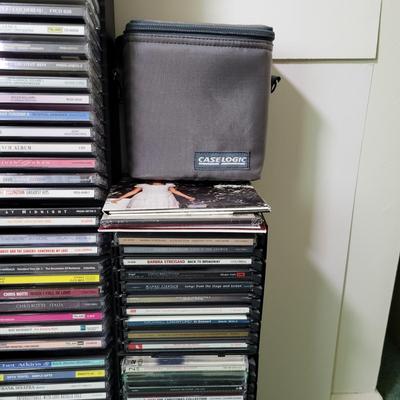 LOT 115L: CD and Cassette Tapes Storage Filled with Assorted Albums and Artists