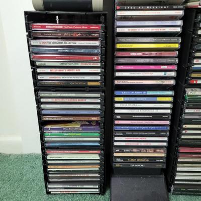 LOT 115L: CD and Cassette Tapes Storage Filled with Assorted Albums and Artists