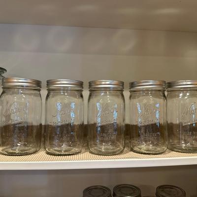 CANNING JARS, MEASURING CUPS AND AN APOTHECARY JAR