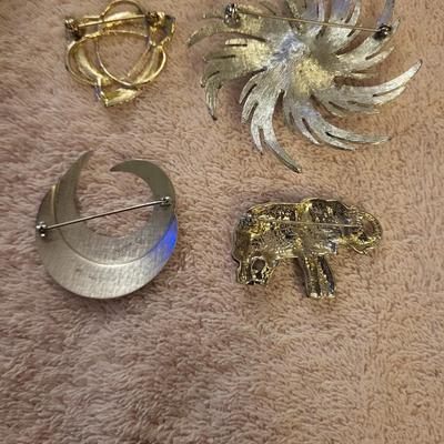 BRACELETS AND BROOCHES