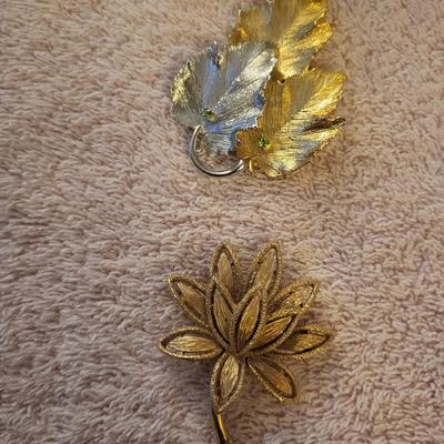 BRACELETS AND BROOCHES