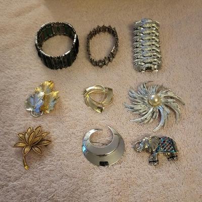 BRACELETS AND BROOCHES