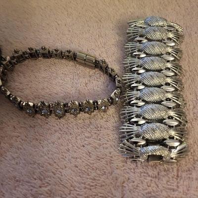 BRACELETS AND BROOCHES
