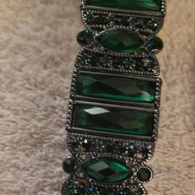 BRACELETS AND BROOCHES