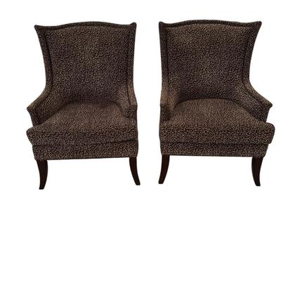 Pair of high back animal printed chairs