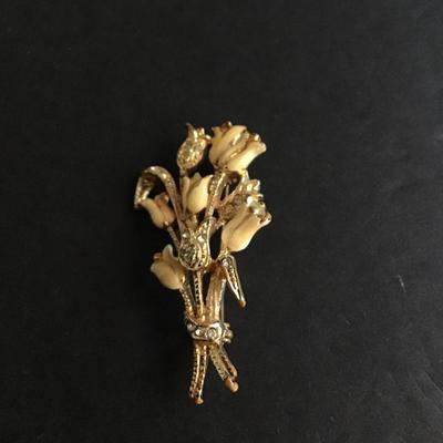 Gold tone brooch with enameled flowers