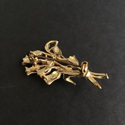Gold tone brooch with enameled flowers