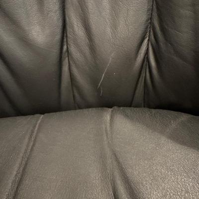 Black leather swivel chair with ottoman