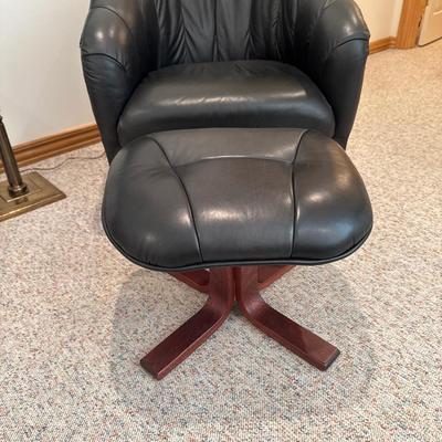 Black leather swivel chair with ottoman