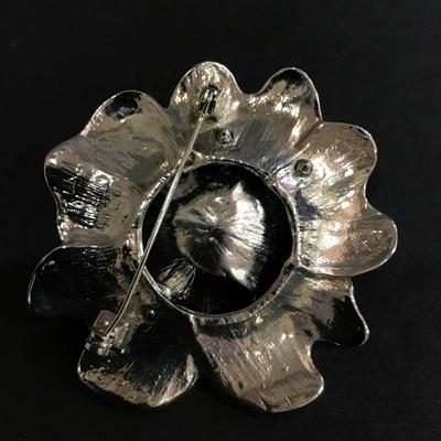 Black enamel flower brooch