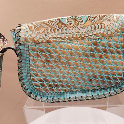 Sale Photo Thumbnail #126: Cross body bag, one zippered pouch, 1 outside pocket 
8 x 10 inches 
New-excellent condition 
Retails $199