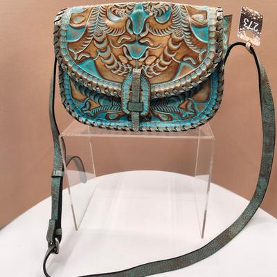 Sale Photo Thumbnail #125: Cross body bag, one zippered pouch, 1 outside pocket 
8 x 10 inches 
New-excellent condition 
Retails $199