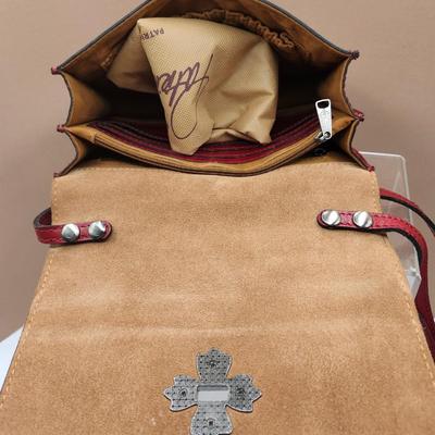 Sale Photo Thumbnail #137: Dust bag, outside zippered area, pockets for credit cards inside,
one outside pocket area 
New
Retails at $169.00