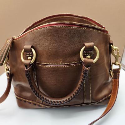 Sale Photo Thumbnail #156: brown leather, dust bag, 3 straps
3 interior pockets, 1 zippered pocket inside
1 outside snapped pocket, 1 outside flap pocket 
Retails $250-$400   excellent condition 
8 x 16 inches