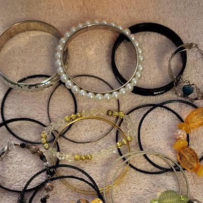 A LARGE ASSORTMENT OF BRACELETS