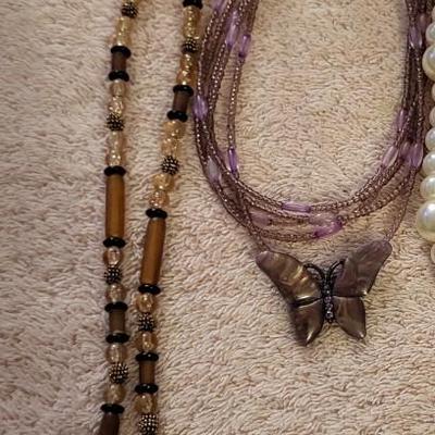 NECKLACES AND A HOLDER