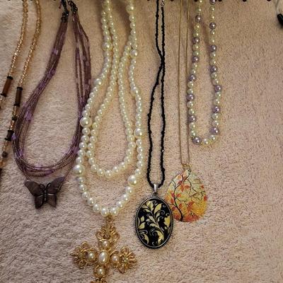 NECKLACES AND A HOLDER