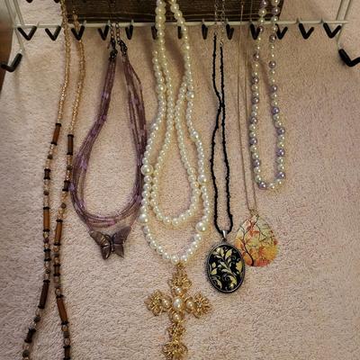 NECKLACES AND A HOLDER