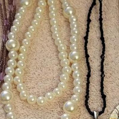 NECKLACES AND A HOLDER