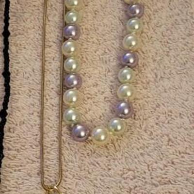 NECKLACES AND A HOLDER