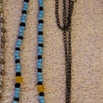NECKLACES AND A HOLDER