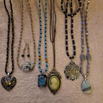 NECKLACES AND A HOLDER