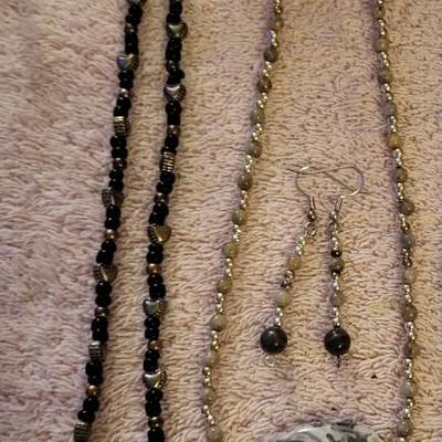 NECKLACES AND A HOLDER