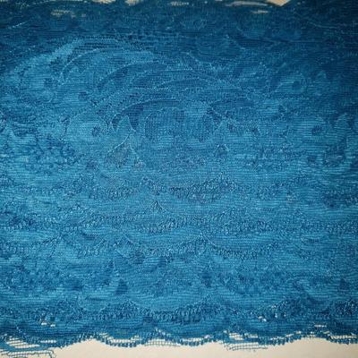 Sale Photo Thumbnail #150: Beautiful teal blue color trim.
1 and 5/8" wide. Pattern repeat is every 3.5 inches. About 32 yards long. Cardboed it is wrapped on says Nylon. Great condition.