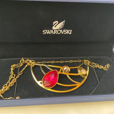 Swarovski large gold tone necklace with red and green crystals