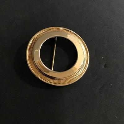 Gold tone circular brooch