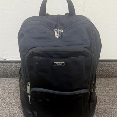 Sale Photo Thumbnail #593: Approx. 11" wide and 15" tall - laptop storage, phone pocket and luggage band. Very good condition, clean inside and out.
