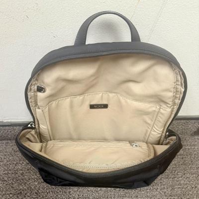 Sale Photo Thumbnail #598: Approx. 11" wide and 15" tall - laptop storage, phone pocket and luggage band. Very good condition, clean inside and out.