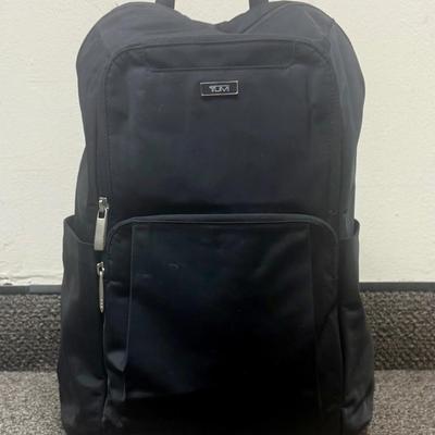 Sale Photo Thumbnail #592: Approx. 11" wide and 15" tall - laptop storage, phone pocket and luggage band. Very good condition, clean inside and out.
