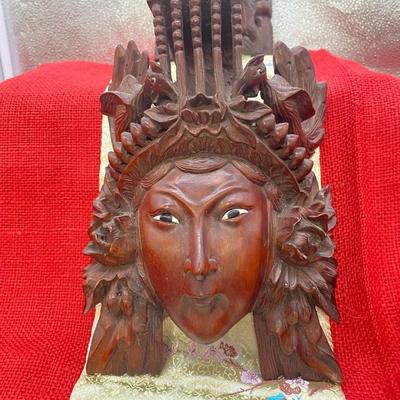Sale Photo Thumbnail #178: The Male figure is 6 inches wide x 8 inches tall.
The are dragons on each side of the mask on the top, there is sone wear on the dragons teeth.

The female figure is 6 inches wide x 8 inches tall.  
There are birds on each side of the mask on the top port